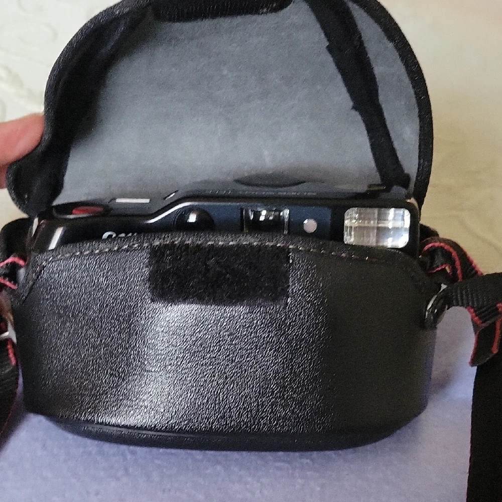 Canon Vintage Black Film Camera with Red Accents